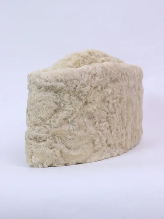 cream colour cap in karakul fur