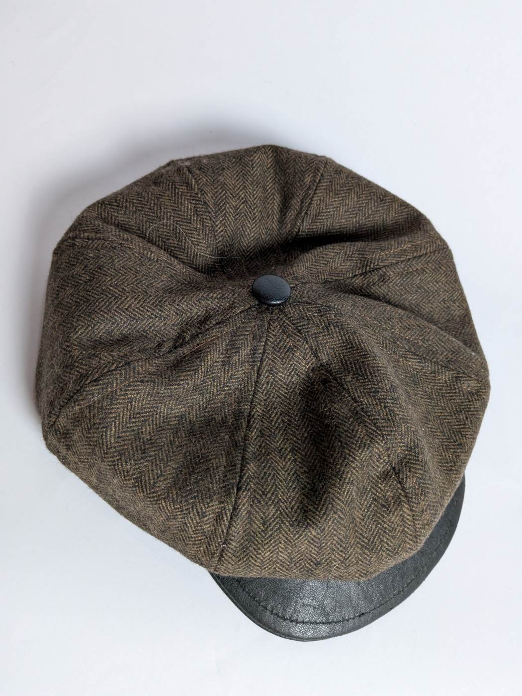 brown tweed and leather cap in oversized french cap style