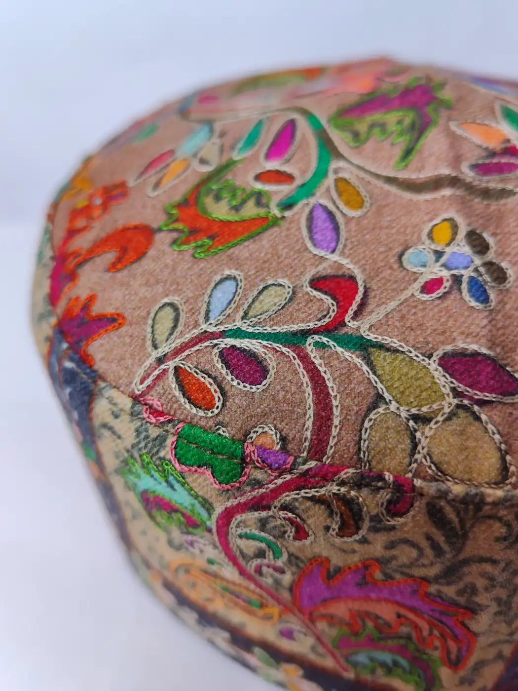 colourful kalamkari embroidery on the Kashmiri round cap