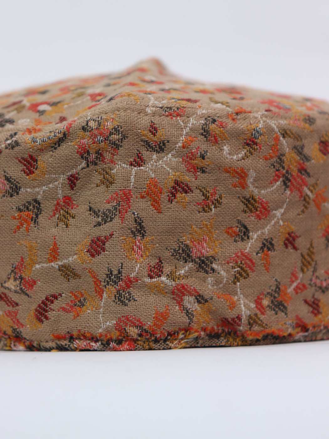 beige cap in florals