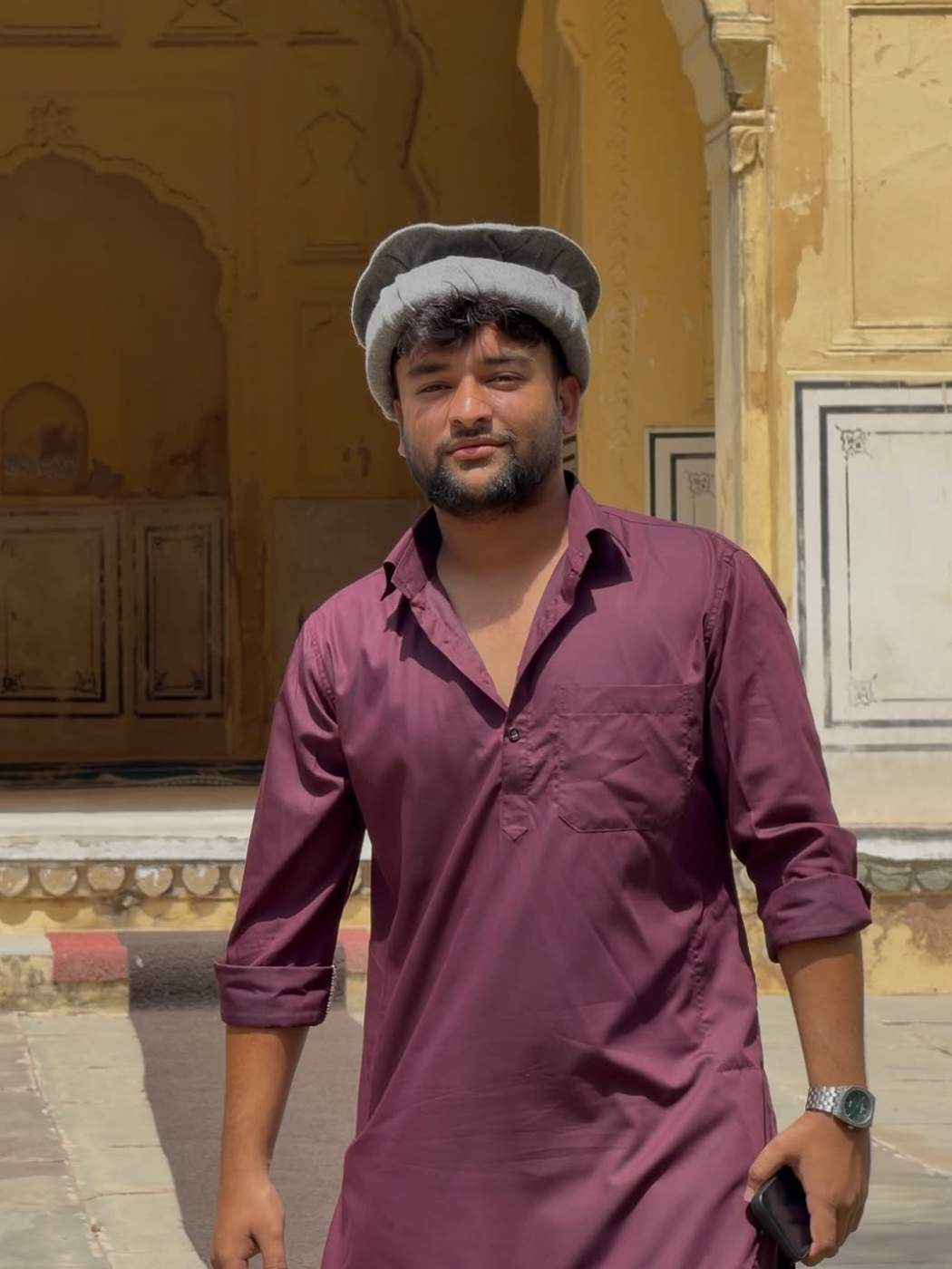man in pathani cap