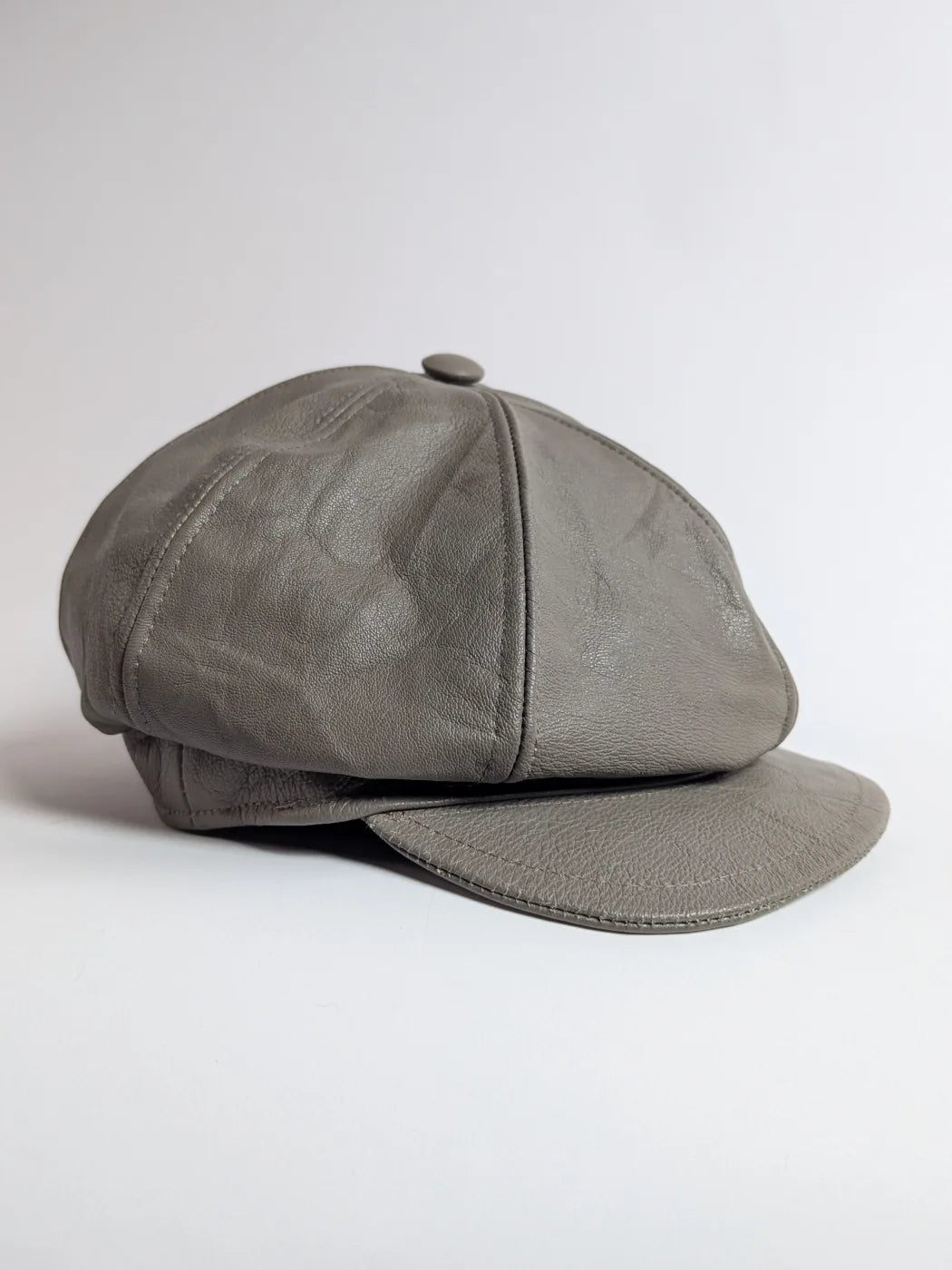 Unique cap in grey leather