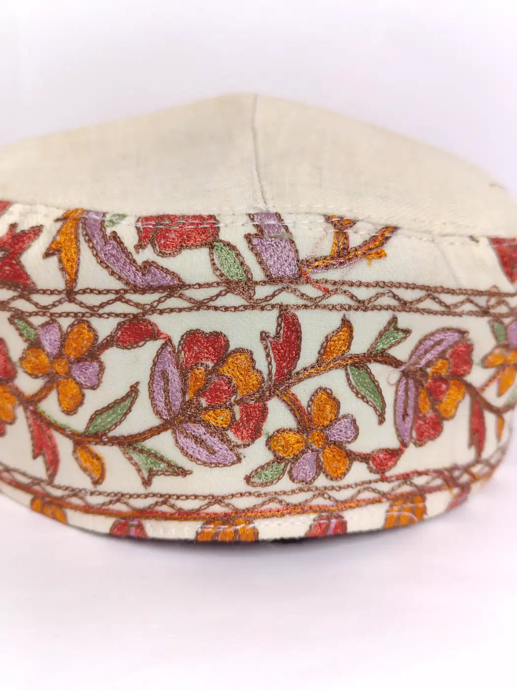 classic cream cap with side aari embroidery