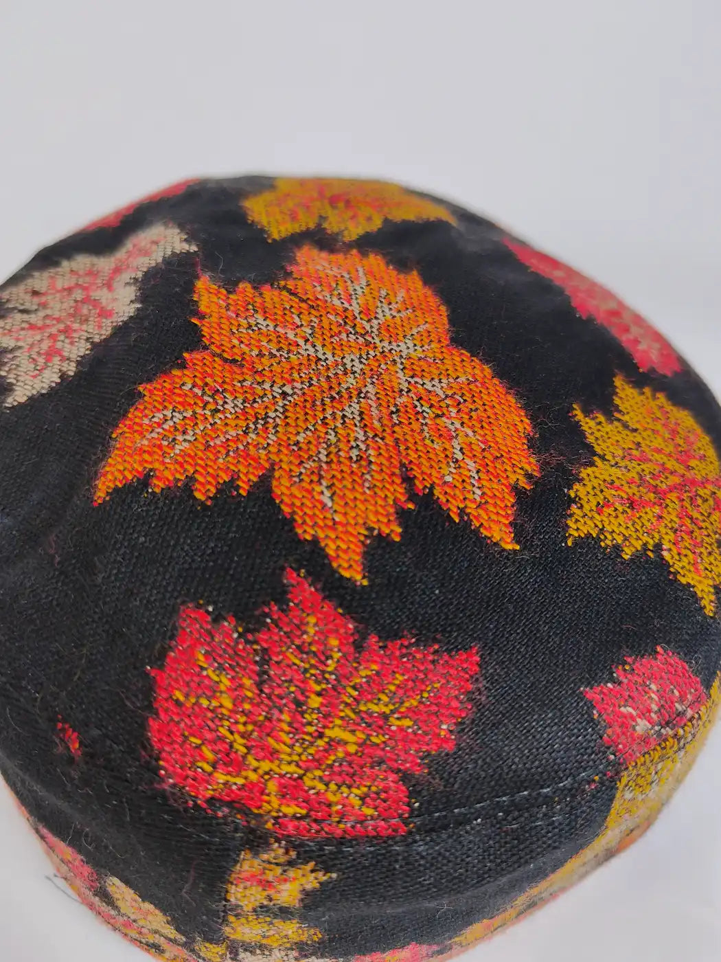 black kani cap top side with chinari pattern