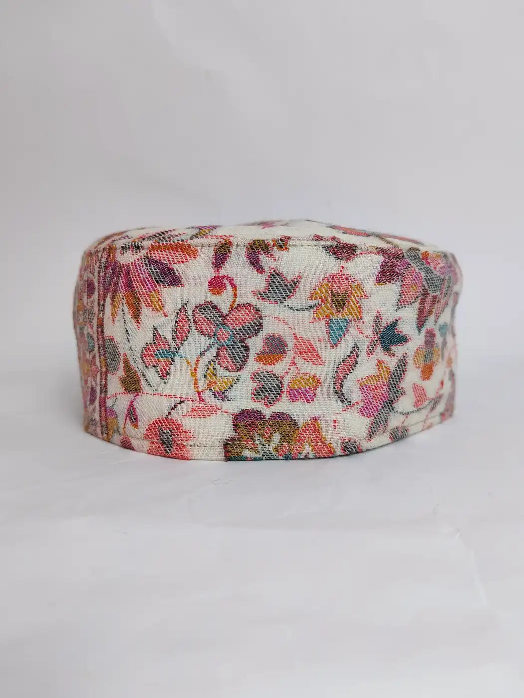 white kani cap with florals across sides
