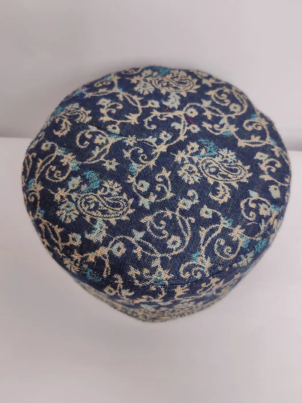Kashmiri kani cap in dark blue with badam and vine woven pattern on top side