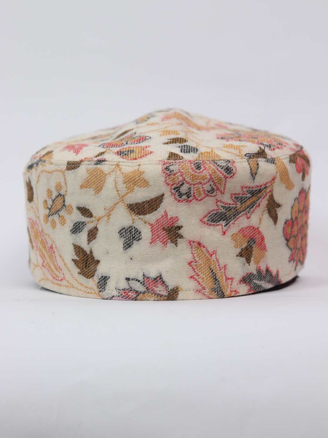 cream cap in floral woven pattern