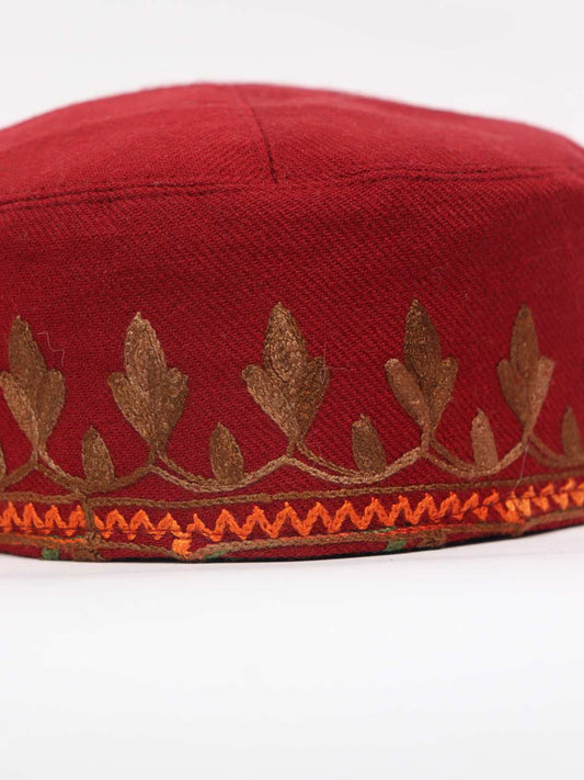 red fabric cap in aari florals