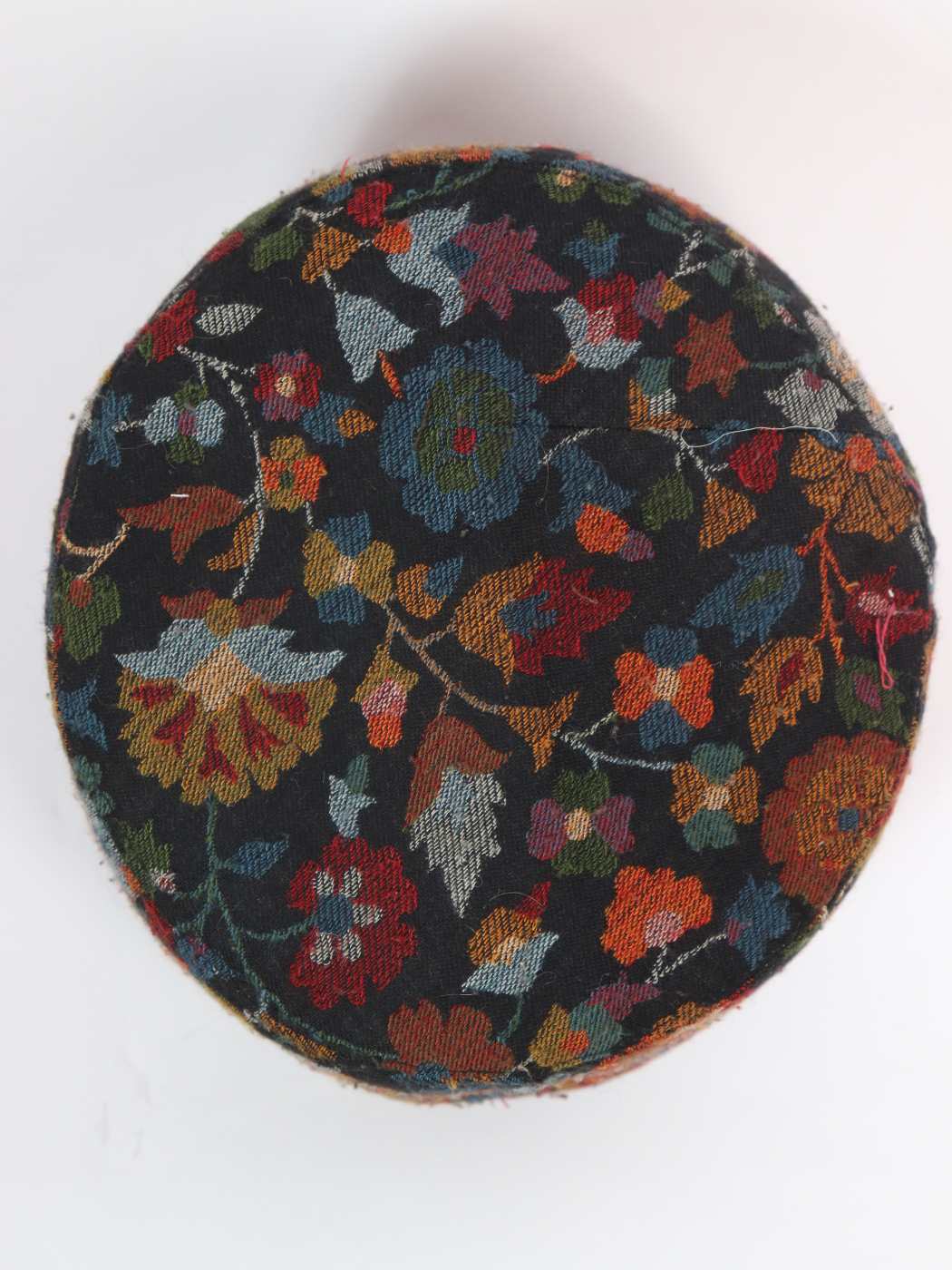 black cap in floral motifs on top side