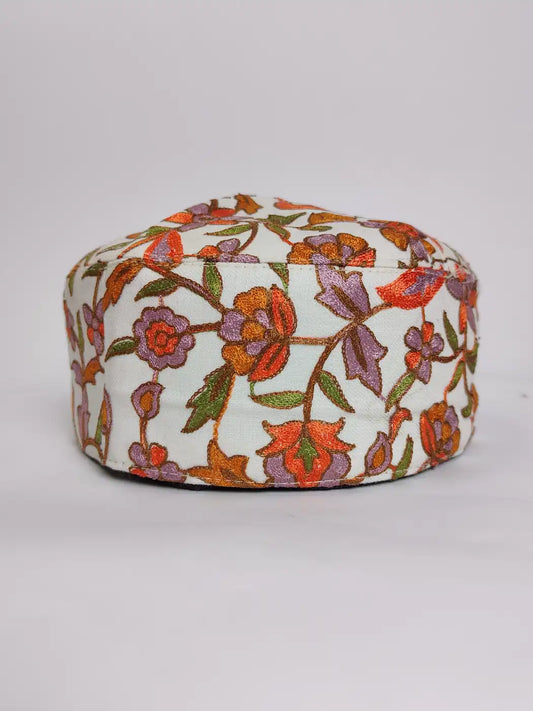 white cap with florals in nalki aari work