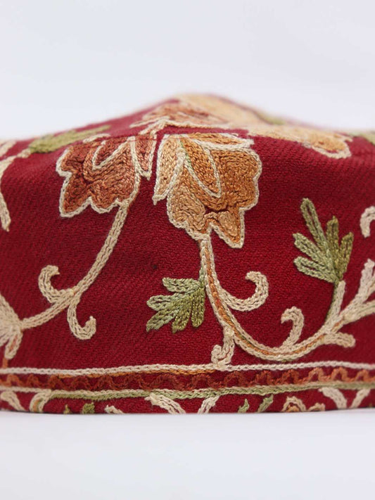red cap in polywool with aari embroidery