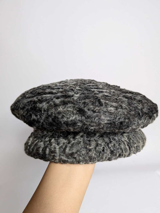 round greyish cap in karakul fur