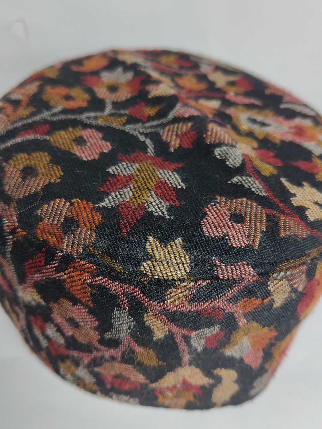 Black kani cap floral woven pattern