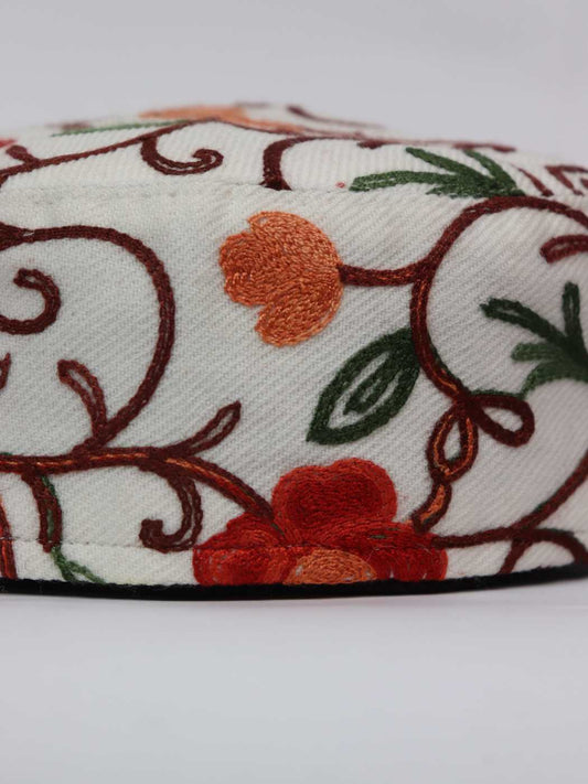 white cap in aari embroidery in floral vine pattern 