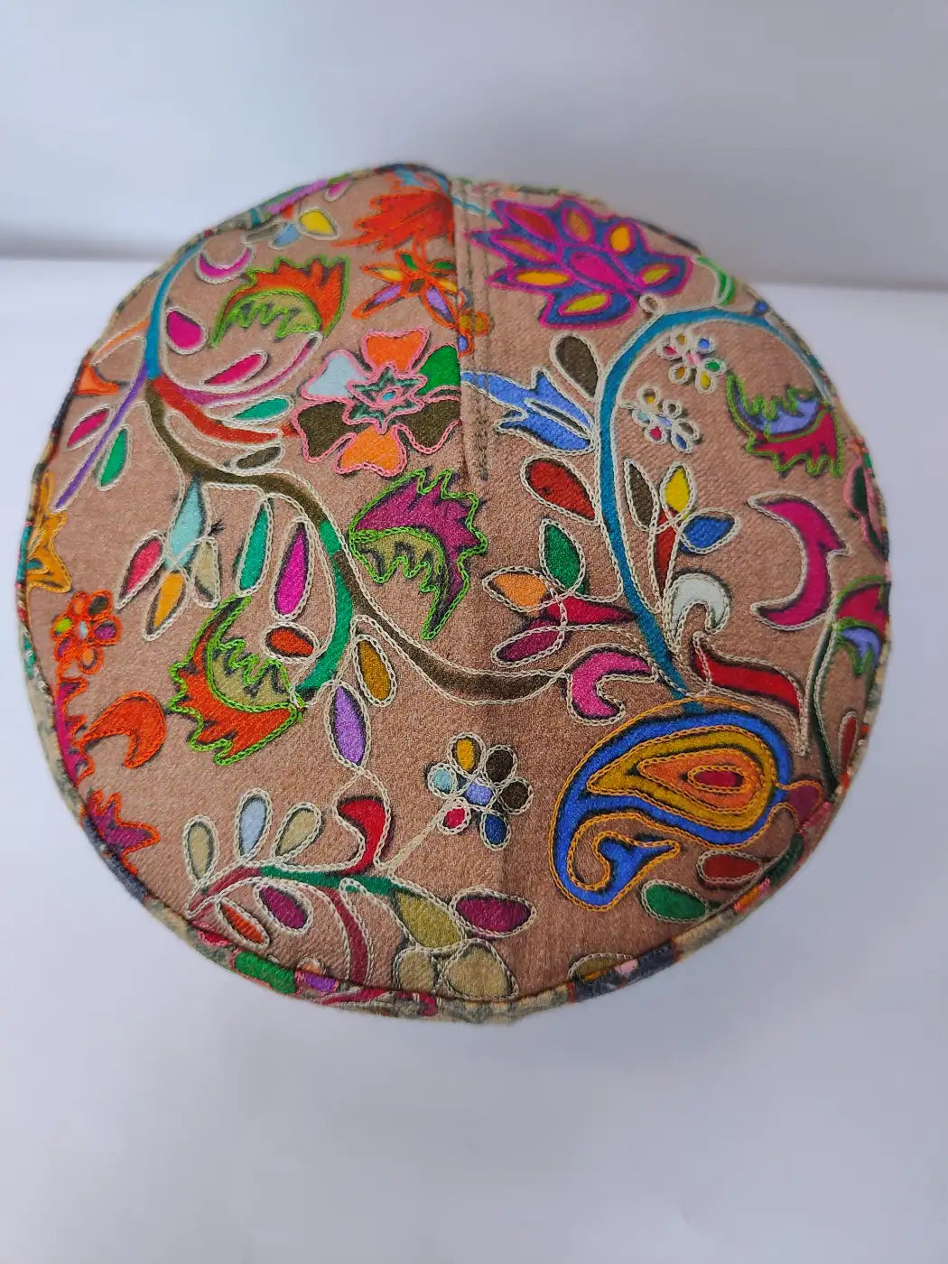 badami pttern kalamkari embroidery on the top side of the cap
