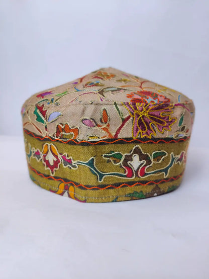 Kalamkari embroidery on the sides of the Kashmiri unique cap