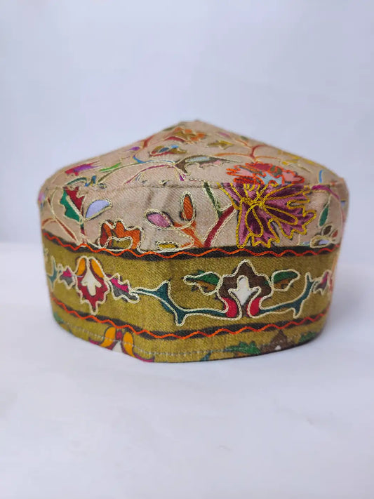 Kalamkari embroidery on the sides of the Kashmiri unique cap