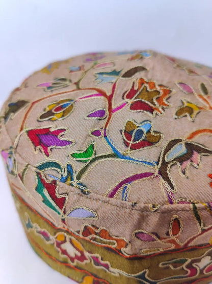 kalamkari work on the beige colour kashmiri cap