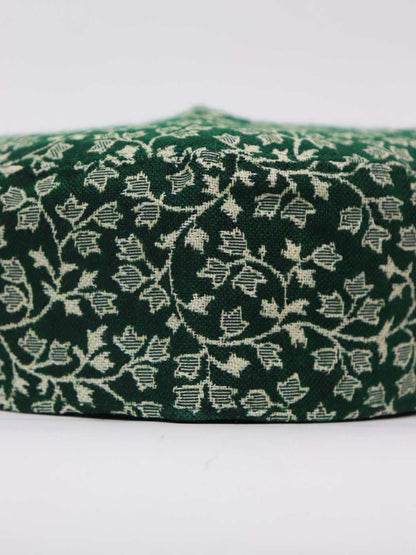 green cap from Kashmir in kani woven pattern