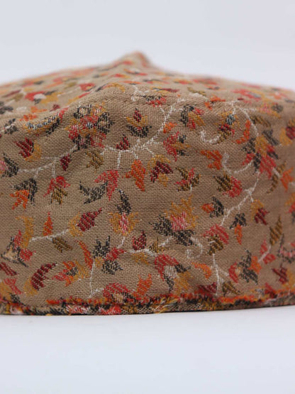 beige cap in florals