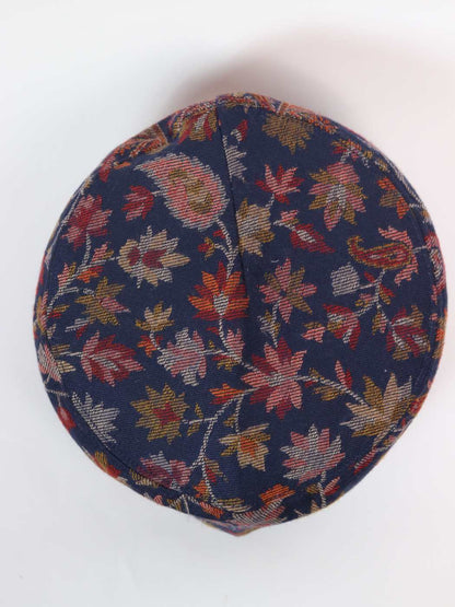 round cap in dark blue with floral patterns