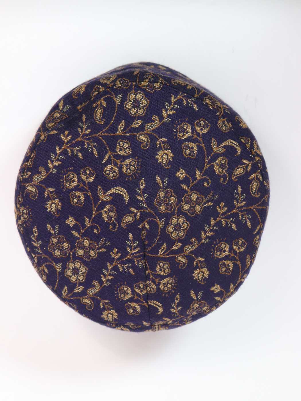 dark blue cap in floral kani woven pattern 