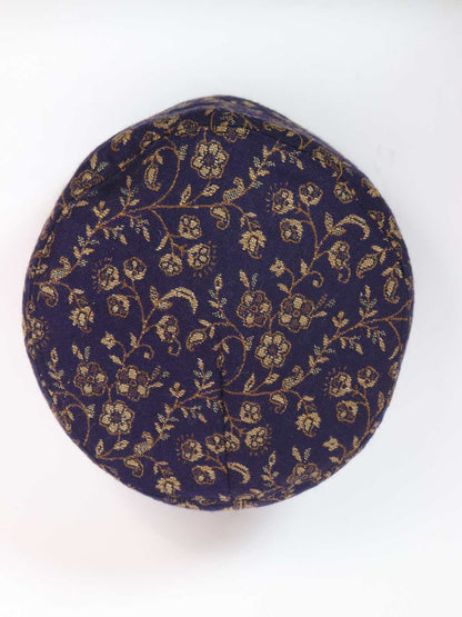 dark blue cap in floral kani woven pattern 
