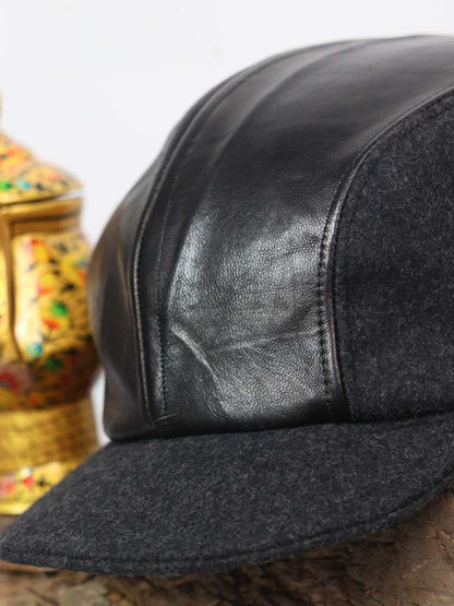 pure leather cap in tweed wool