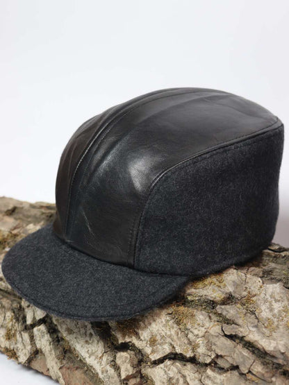 black cap in pure leather and tweed
