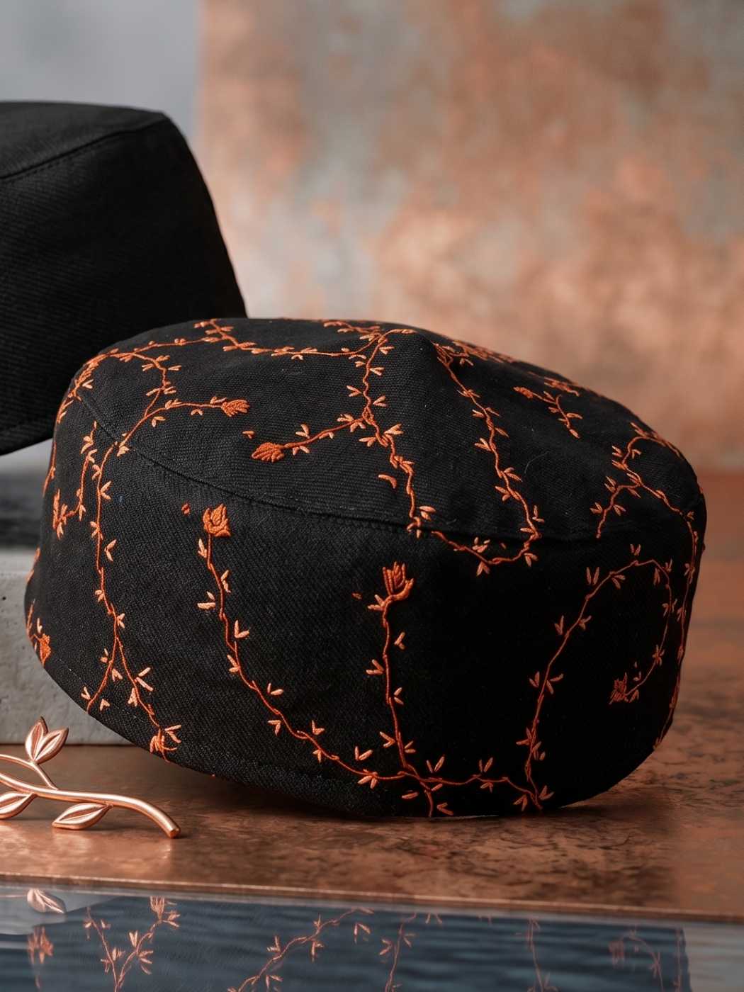 vine pattern on black Kashmiri round sozni cap
