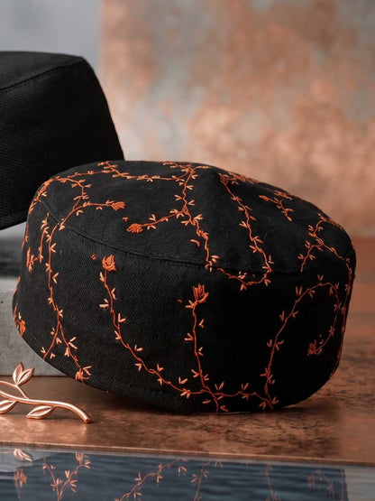 vine pattern on black Kashmiri round sozni cap