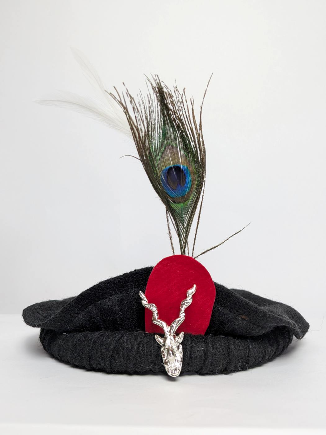 black chitrali pakol cap with markhor and feather