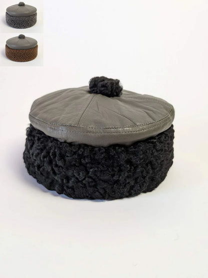 round leather cap with karakul fur across sides 