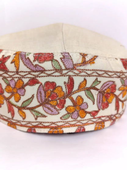 classic cream cap with side aari embroidery