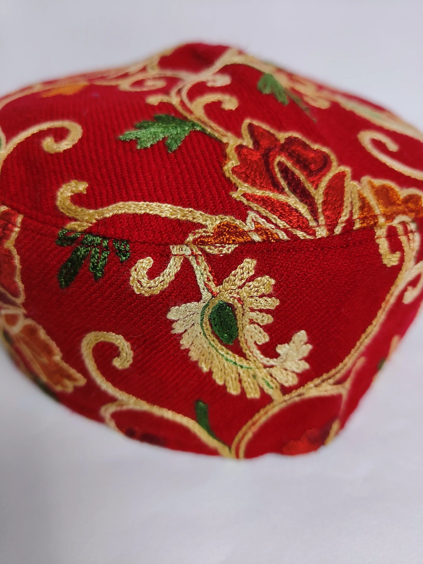 red foldable cap with aari work