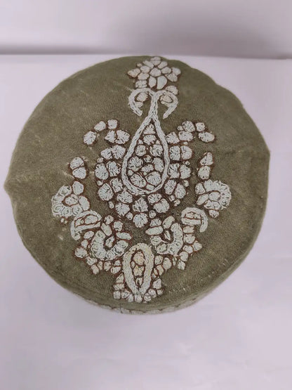 green cap with hand sozni embroidery on top side