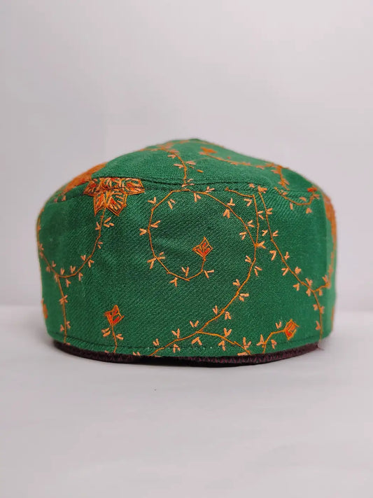 Green embroidered cap on a white background