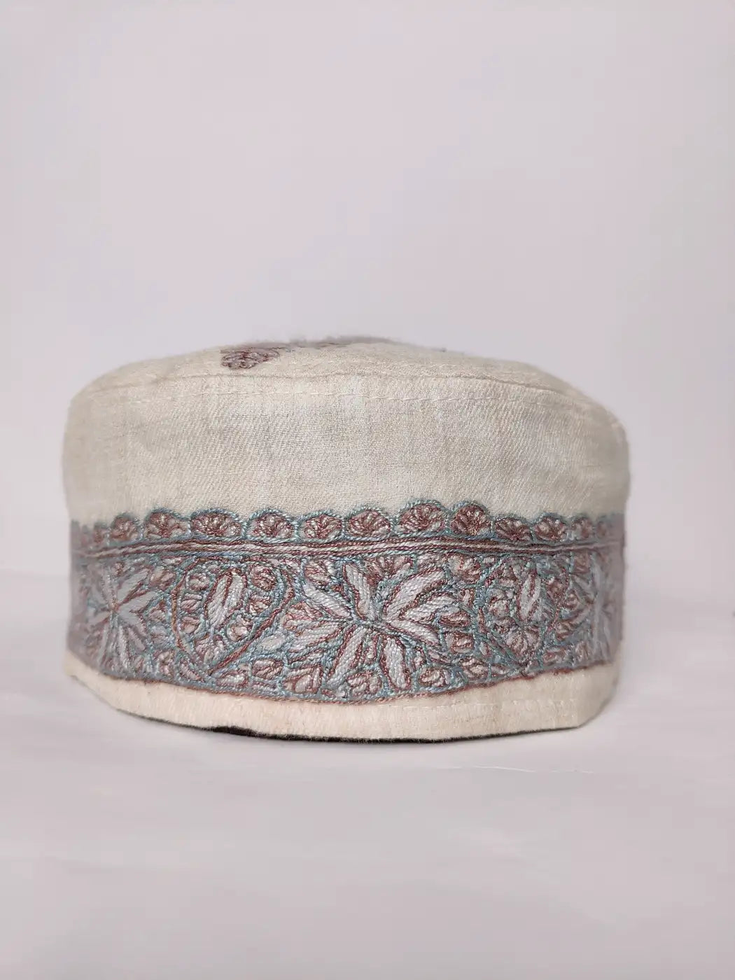 white cap from Kashmir with hand sozni embroidery 