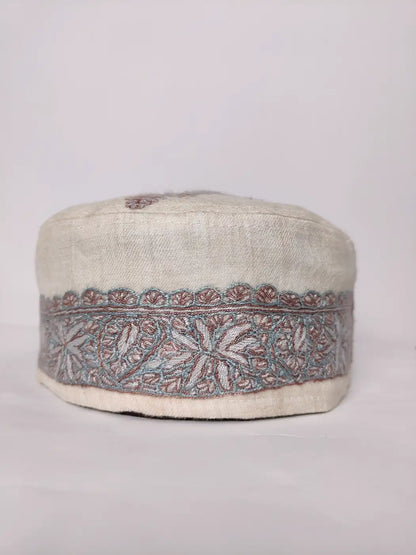 white cap from Kashmir with hand sozni embroidery 