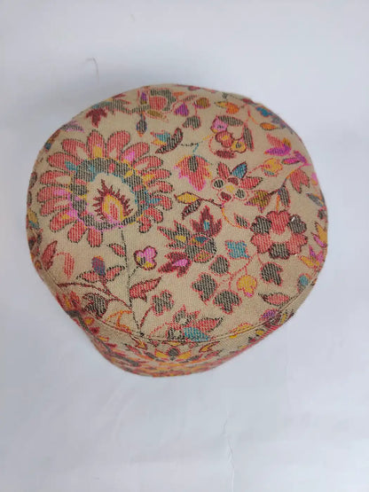 beige kani topi with woven florals on top side