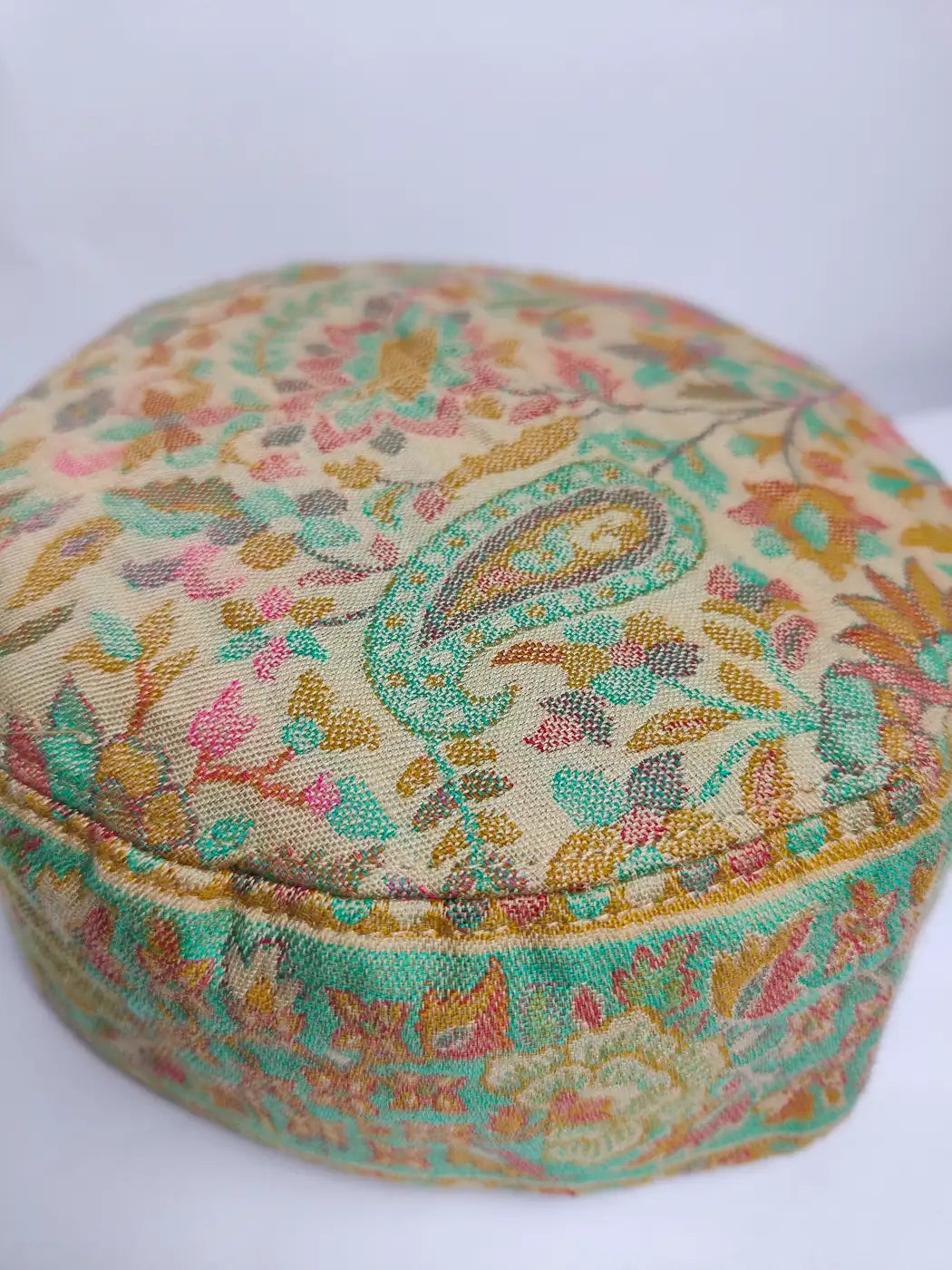 Round Kashmiri cap in beige colour with floral and badam