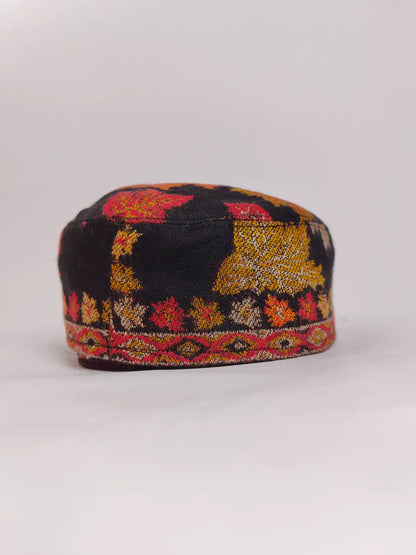 black kani cap in floral woven pattern 