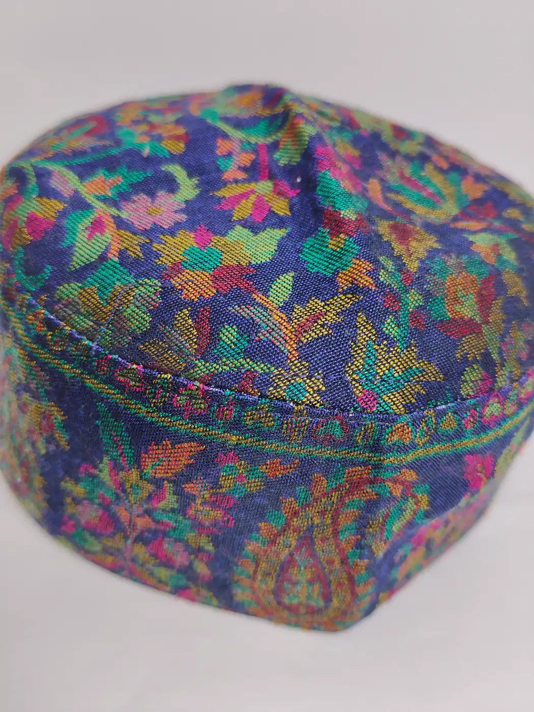 dark blue kani cap in floral woven pattern
