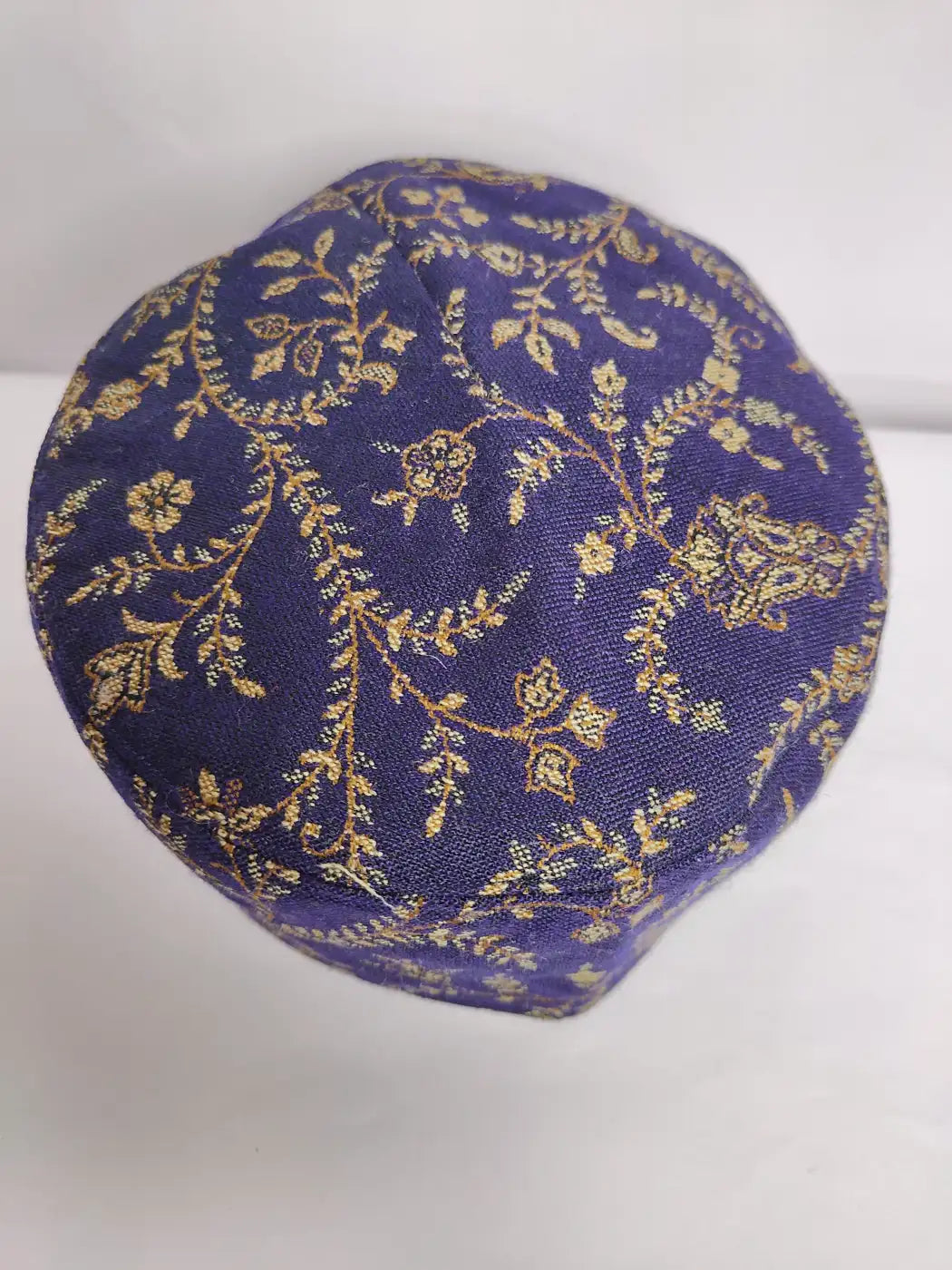 dark blue kashmiri kani cap in floral vine pattern top side