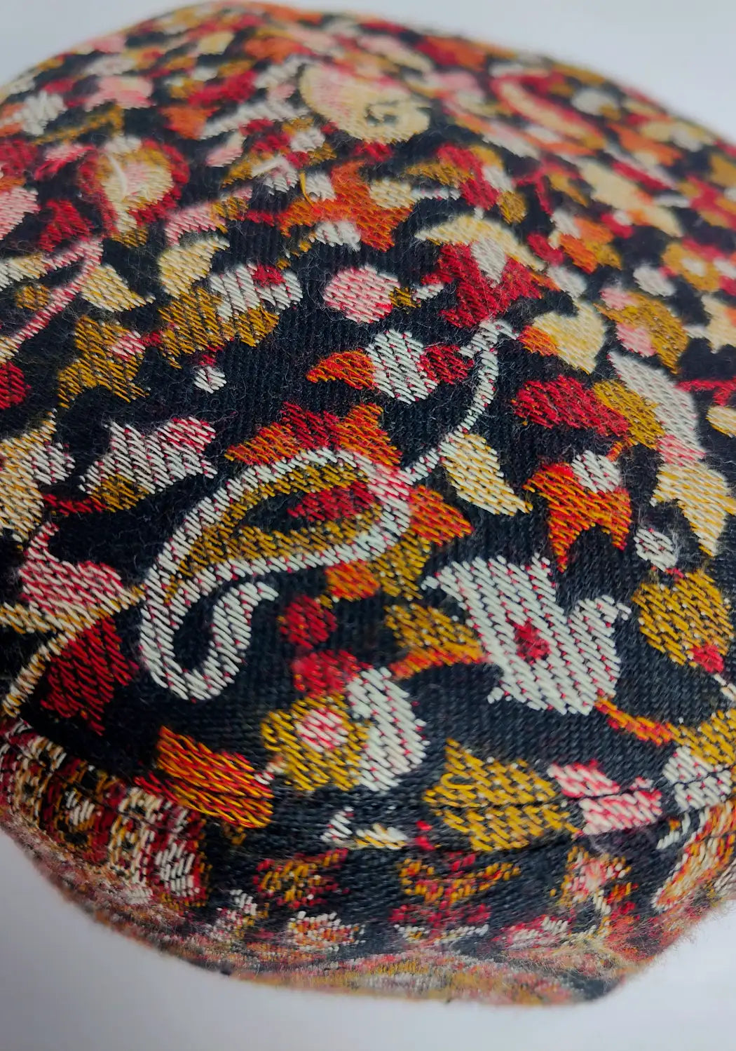 black cap with floral embroidery in kani 