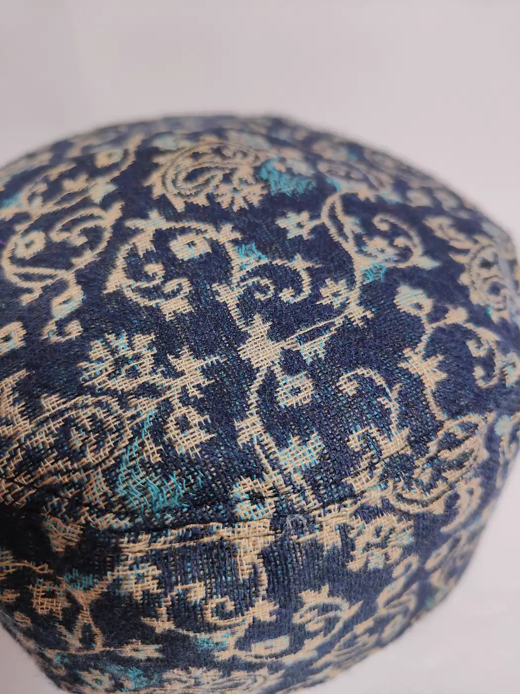 dark blue Kashmiri kani cap with floral vine pattern 