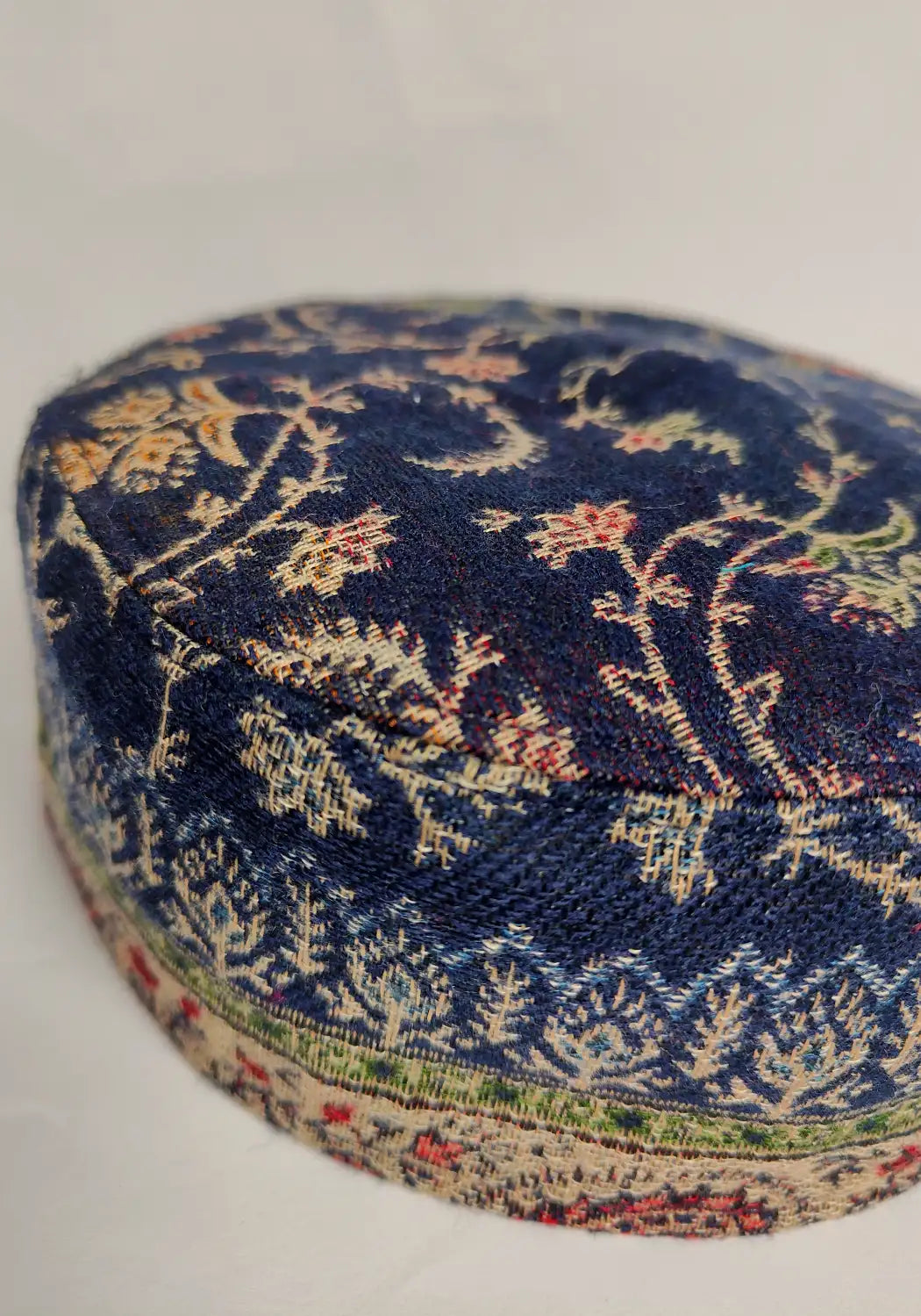 dark blue kani cap with floral work