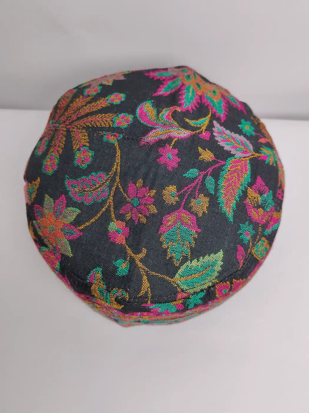Black topi in florals on top side
