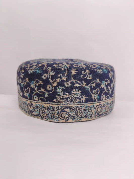 dark blue cap with badam vine pattern across border