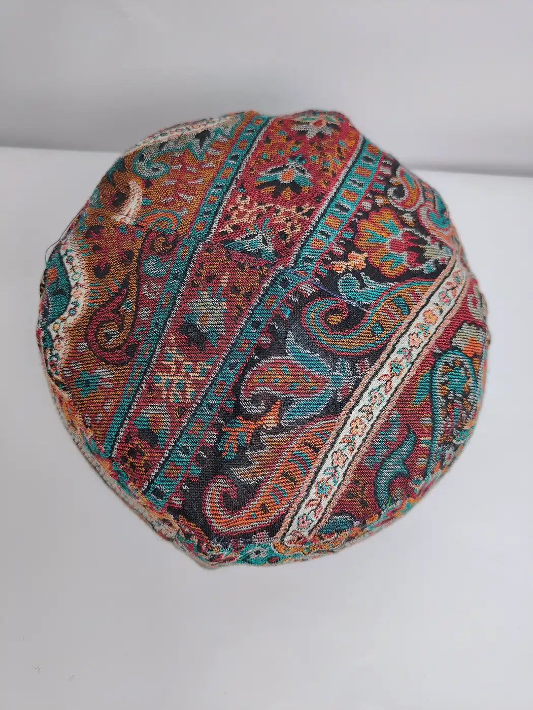 Colorful embroidered cap in kani on top side